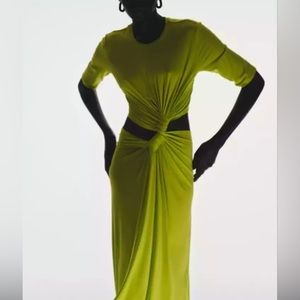 This Front twist dress features sides out and back midi length